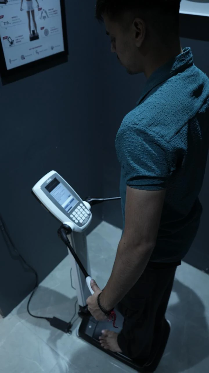 COREO member using body composition assessment equipment