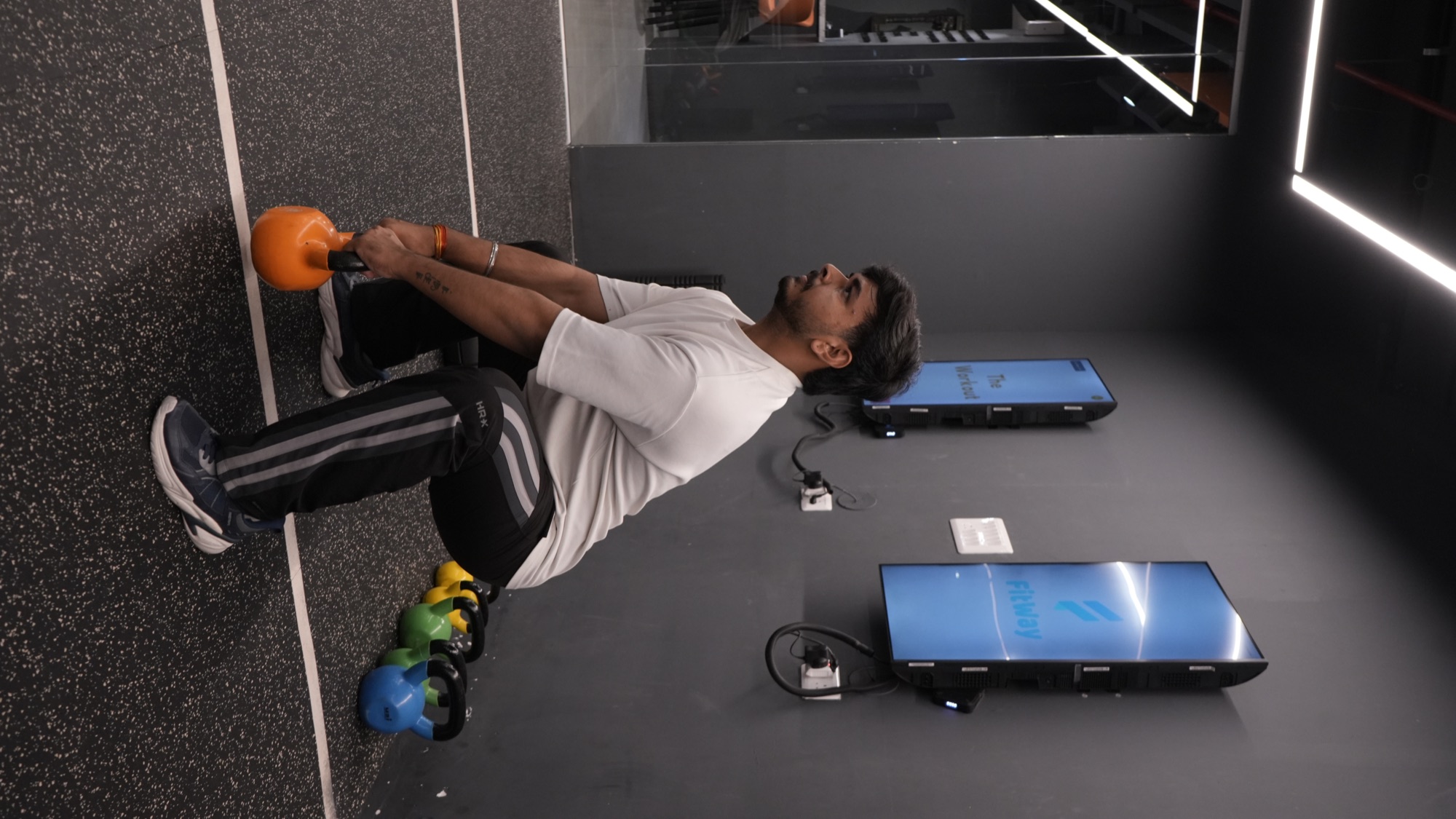COREO member lifting a kettlebell during functional training