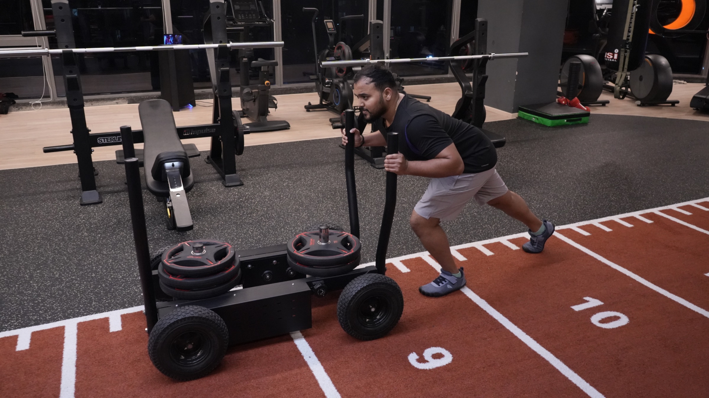 COREO member pushing a weighted sled