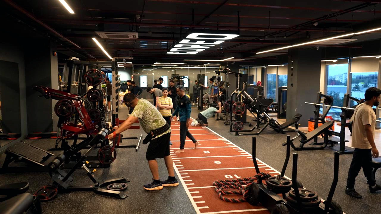 COREO training floor with gym equipment and orange track