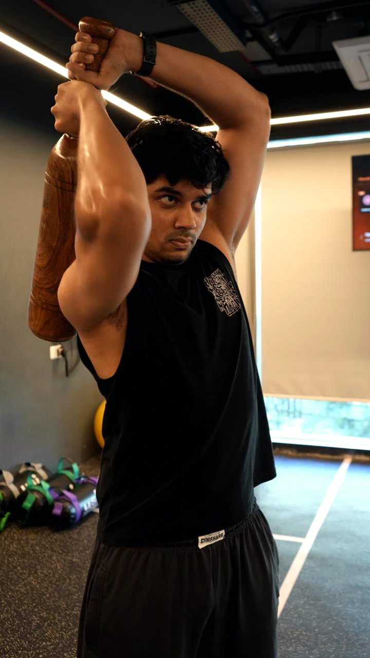 COREO member stretching with a training tool